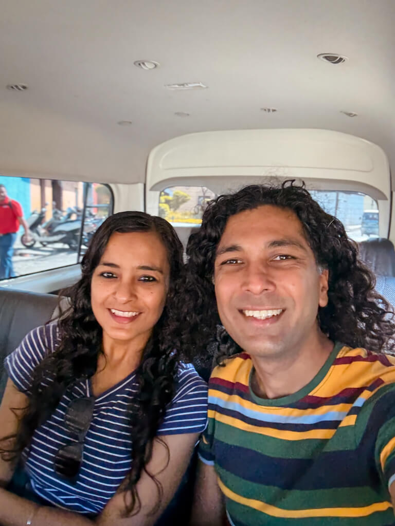 A woman and a man, seated inside the direct shuttle from Antigua Guatemala to San Pedro La Laguna.