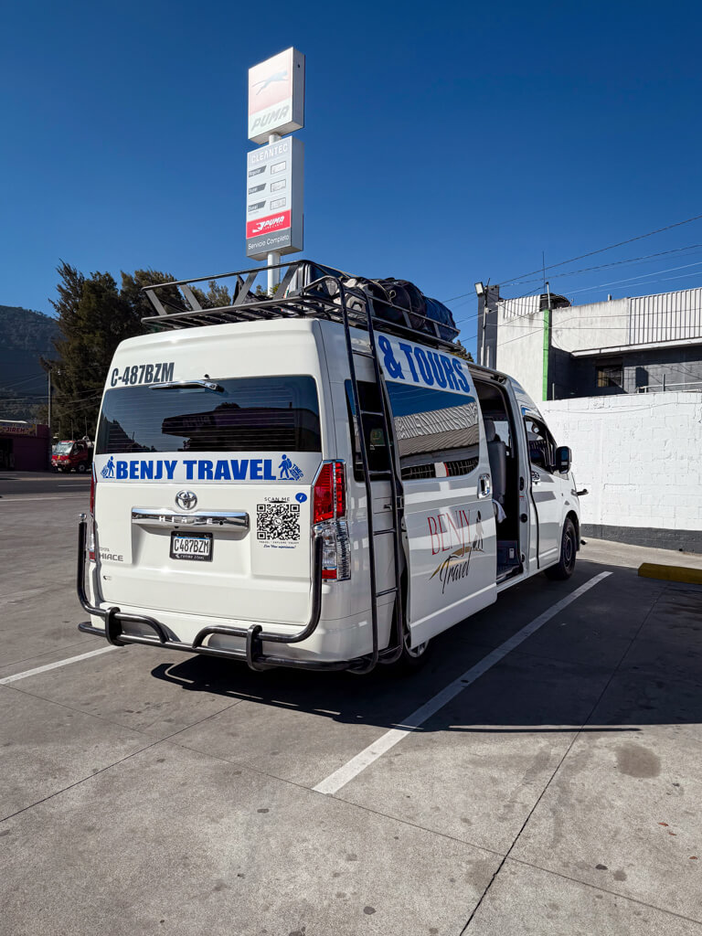 A white minivan, the vehicle for the direct transfer from Antigua Guatemala to San Pedro La Laguna.