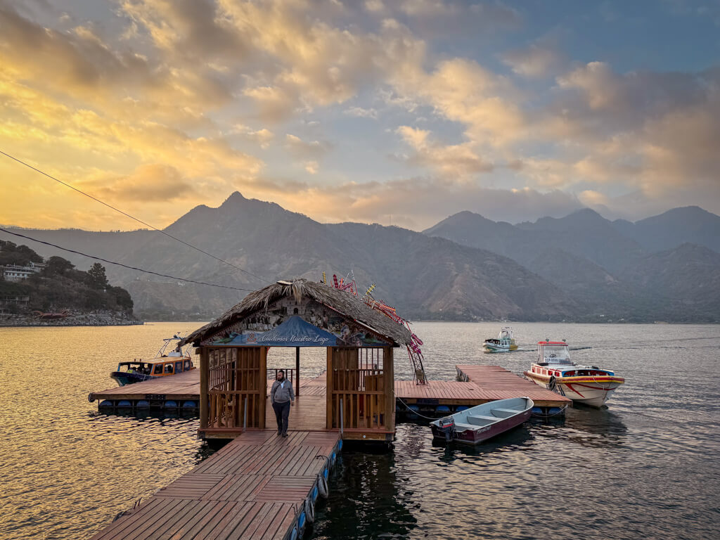 Sunset hour at the main boat dock in San Pedro La Laguna, Lake Atitlan in Guatemala. This is where you arrive if coming by boat from Panajachel.