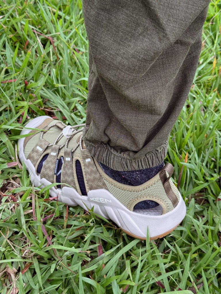 A man's foot wearing Keen waterproof sandals in Costa Rica.