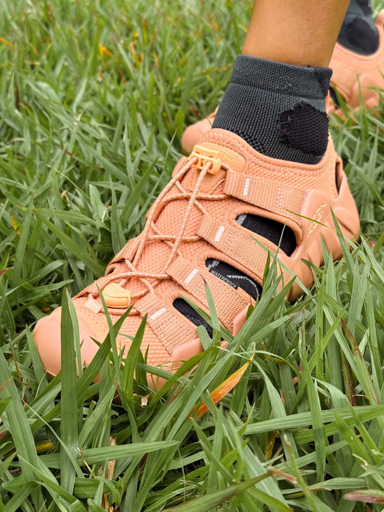 A woman's feet wearing Keen waterproof sandals in Costa Rica.