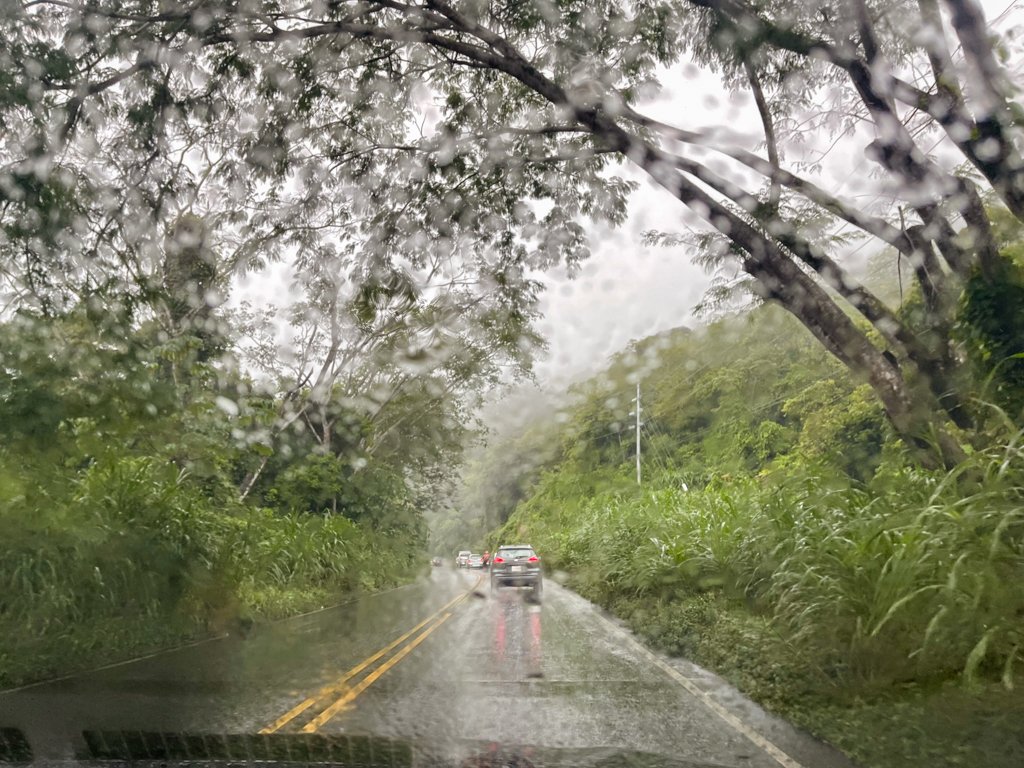 Cars seen through the windscreen on the road during rain in Costa Rica.