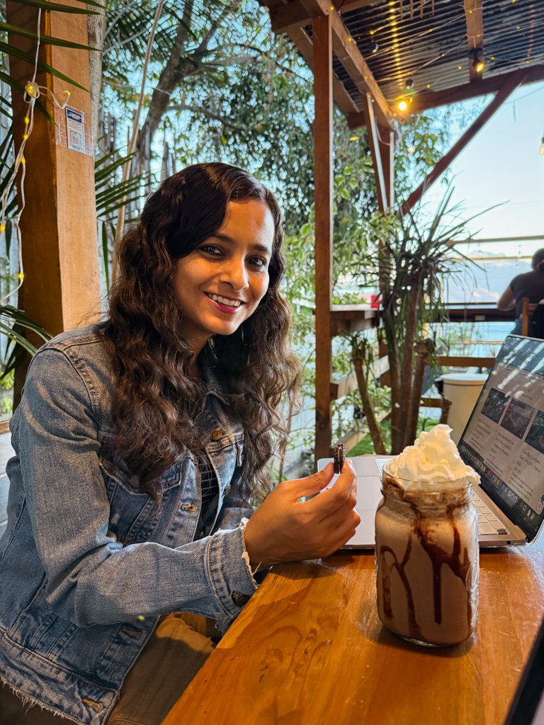 A woman working remotely in a cafe in Guatemala. Part of the nomad life.